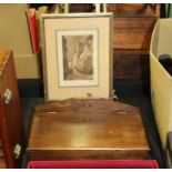 Brass easel with cast rococo scroll decoration, framed depicting a street scene, candle box (3)