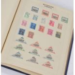 Early to mid 20th Century stamp album, containing mounted and unmounted stamps