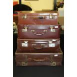 Four brown leatherette suitcases (4)