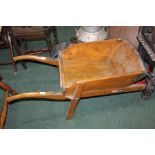 Wooden wheel barrow with metal mounts