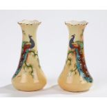 Pair of Locke & Co Worcester vases, both decorated with a peacock amongst foliage on a yellow