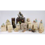 Cherished Teddies, a collection of twelve boxed examples, together with two boxed Boyd Bears and