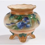 Hadley's Worcester four-footed vase, the blush ground with floral decorations and relief borders,