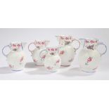 Coalport The Caughley Mask-Head jug, to include a trio with blue edging and flower decoration,