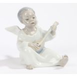 Lladro porcelain figure depicting an angel playing the guitar, 11cm high