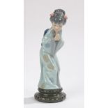 Lladro figure depicting a geisha bowing with her hands together, on a circular plinth, 28cm high