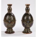 Pair of Royal Doulton stoneware vases, baluster shape relief-moulded with rosettes and incised