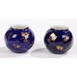 Pair of Royal Worcester ovoid vases, the spirally twisted bodies decorated with floral sprays