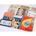 Stamp albums and packets, to include Royal Mint sets