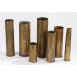A quantity of brass shell cases of various calibres including, 105 mm M14, 25 Pdr dated 1943, 40