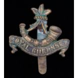 Cap badge to the Guernsey Light Infantry, slider to the reverse