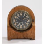 Second World War German 8 day naval clock by Kienzle, black dial with luminous Arabic numerals and