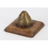 Desk ornament in the form of a First World War shell fuze mounted on a wooden base