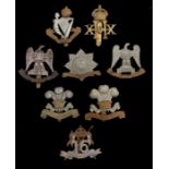 Grouping of British army cavalry regiment badges, 16th Lancers, Royal Scots Greys (2), 20th Hussars,