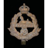 World War One brass economy O/R's cap badge to the East Lancashire Regiment, slider to the reverse