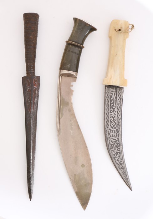 Ornamental kukri with horn handle and white metal fittings, together with a Middle Eastern