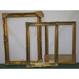 Three large gilt picture frames, the largest 77cm x 109cm, (3)