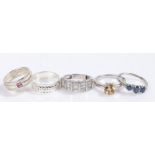 Five silver and coloured paste set rings, various sizes and styles, to include a yellow paste set