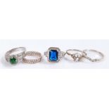 Five silver and coloured paste set rings, various sizes and styles, to include a blue and clear