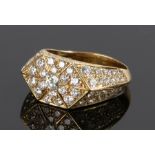 18 carat gold diamond set ring, with round cut diamonds to the shaped head and shoulders, total