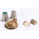 Silver thimble, together with a pair of earrings converted from a cufflink and a key hole