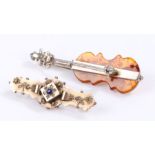 9 carat gold brooch with central blue stone, white metal and amber brooch in the form of a cello (
