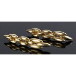 Cartier, a pair of 18 carat gold earing drops, with elongated drops, signed CARTIER 1989, 62mm long