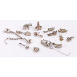 Fifteen silver charms, silver charm bracelet in two pieces, 39.2g (qty)Charm bracelet is broken into