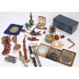 Collection of items, to include a treen spoon, an egg, beads, ambrotypes, watches, money box, carved