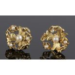 Pair of 18 carat gold pearl set ear studs, in the form of flower heads, 16mm diameter