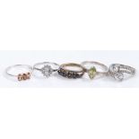 Five silver and coloured paste set rings, various sizes and styles, to include a cross-over style