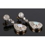 Pair of opal and diamond set earing drops, with a pear shaped drop with a central opal and diamond