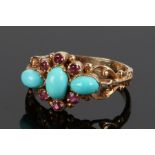 9 carat gold turquoise and ruby set ring, with scroll and swag shoulders, ring size M