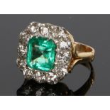Impressive Columbian emerald and diamond set ring, the central emerald at 2.45 carat octagonal cut