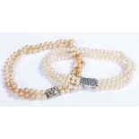 Synthetic pearl three strand necklace with clear and blue paste set clasp, similar two strand