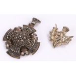 Jerusalem silver cross form pendant, silver thistle form brooch, 19.1g (2)Surface scratches to