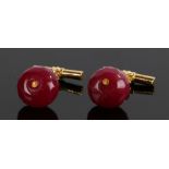 Pair of ruby cufflinks, with facetted rubies