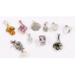 Ten silver pendants, to include an amber set example, 19.6g (10)Floral pearl effect pendant with