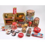 Coca-Cola interest, a collection of tins and die-cast metal banks, four model train carriages, and