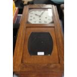 Oak cased wall clock, with an Art Deco design