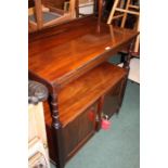 Edwardian mahogany buffet, the rectangular top above an under tier and a pair of cupboard doors,