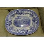 19th Century blue and white transfer decorated meat/serving plate, decorated with two travellers and