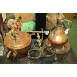 Middle Eastern copper coffee pot on stand, a tea pot, bottle carrier and a stand, (4)