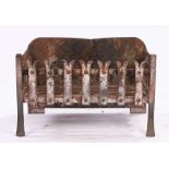 Cast iron fire basket, with a low back and basket with spilt arched end tops, 54cm wide