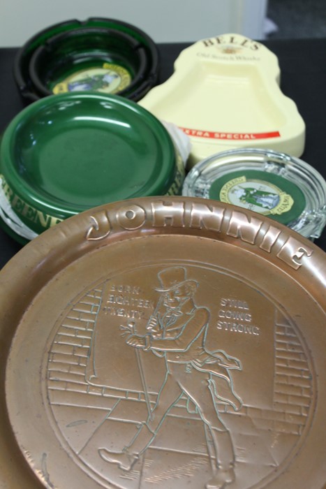 Johnnie Walker copper tray, together with a selection of advertising ashtrays, (qty)