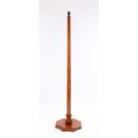 Mid 20th Century mahogany standard lamp, with octagonal tapering stem raised on an octagonal
