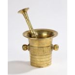 Mid 19th century German brass pestle and mortar, both with reeded decoration, the mortar with