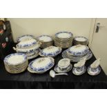 Extensive Ashworth dinner service, with blue and white transfer decoration depicting stylised