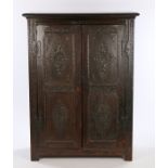 17th Century style oak cupboard, with a concave cornice above two 17th Century carved long panel