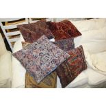 Seven cushions, to include six cushions made from Middle Eastern rugs and another cushion, (7)